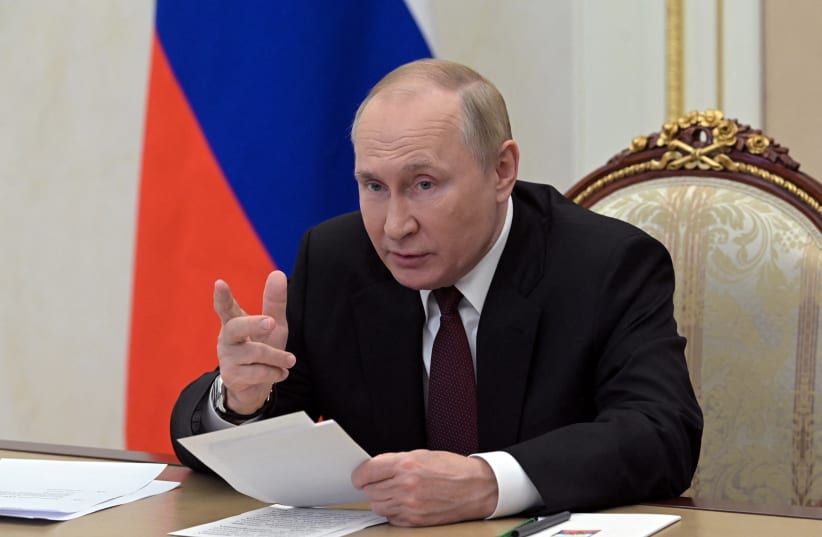  Russian President Vladimir Putin addresses heads of security and intelligence agencies of the Commonwealth of Independent States (CIS) member states via a video link in Moscow, Russia October 26, 2022.  (photo credit: SPUTNIK/ALEXEI BABUSHKIN/KREMLIN VIA REUTERS)