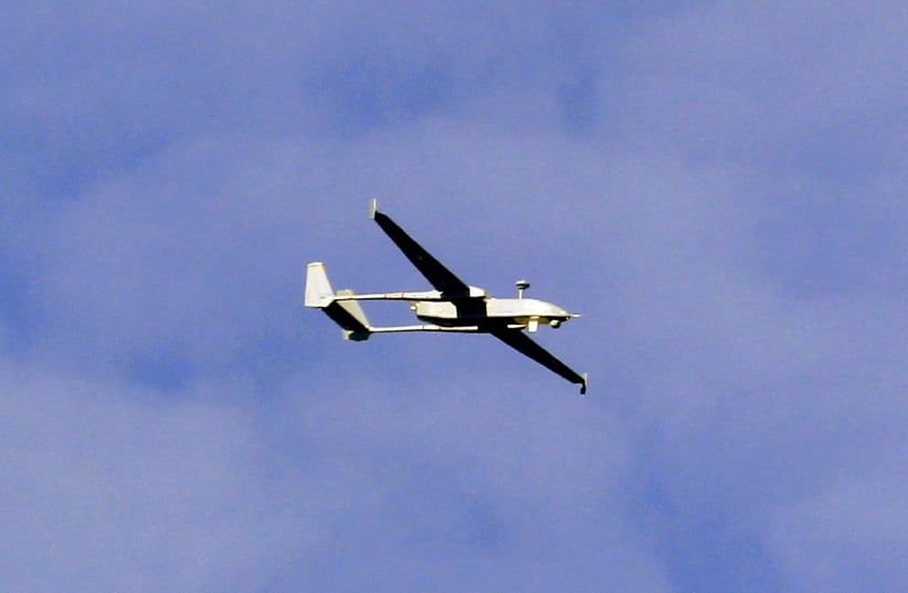  An Israel Aero Space Industries (IAI) Heron 1 unmanned aerial vehicle (UAV) flies over the airbase in the central Swiss town of Emmen September 20, 2012. (photo credit: Arnd Wiegmann/Reuters)