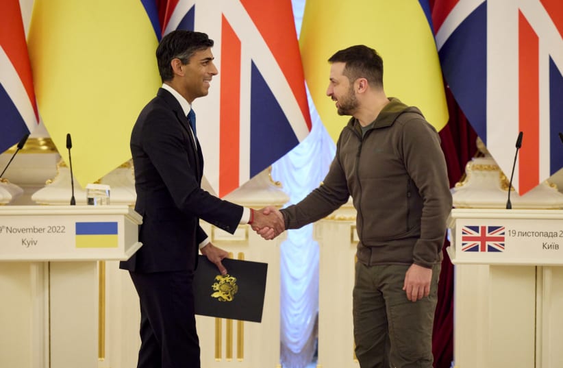  Ukraine's President Volodymyr Zelensky shakes hands with British Prime Minister Rishi Sunak during his visit, as Russia's attack on Ukraine continues, in Kyiv, Ukraine November 19, 2022.  (photo credit: Ukrainian Presidential Press Service/Handout via REUTERS)