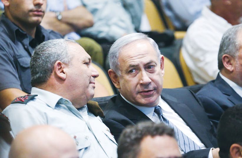  THEN-PRIME MINISTER Benjamin Netanyahu and then-IDF chief of staff Gadi Eisenkot attend the graduation ceremony at the National Security College in 2016. (photo credit: FLASH90)