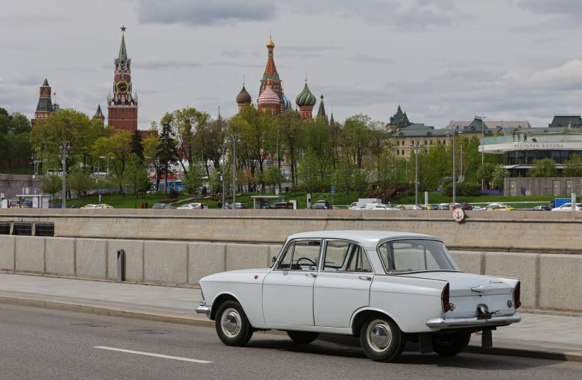  A Soviet-era Moskvich 408 of 1966 is pictured on the embankment of the Moskva River in Moscow (photo credit: REUTERS)