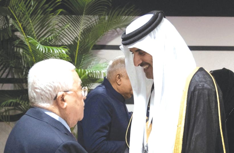  PA PRESIDENT Mahmoud Abbas is received by Qatari Emir Sheikh Tamim bin Hamad al-Thani on the sidelines of the World Cup in Doha, earlier this week. The Palestinian Authority, with its decreasing legitimacy in the eyes of Palestinians, appears increasingly like a car with no steering wheel and faili (photo credit: REUTERS)