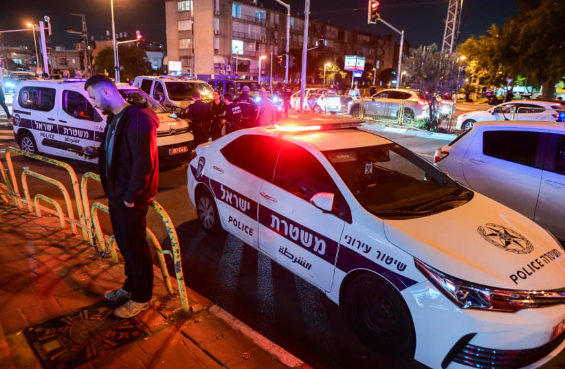  Police at the scene where a man killed after being stabbed during a road rage incident in Holon, on November 23, 2022 (photo credit: AVSHALOM SASSONI/FLASH90)