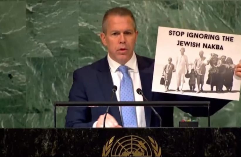  Israel's Ambassador to the UN Gilad Erdan is seen holding up a sign reading "Stop ignoring Jewish Nakba," at the United Nations, on November 30, 2022. (photo credit: ISRAEL AT THE UN)
