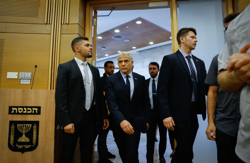  Israeli Prime Minister and Head of the Yesh Atid party Yair Lapid arrives to a faction meeting at the Knesset, the Israeli parliament in Jerusalem, on December 5, 2022 (photo credit: OLIVIER FITOUSSI/FLASH90)