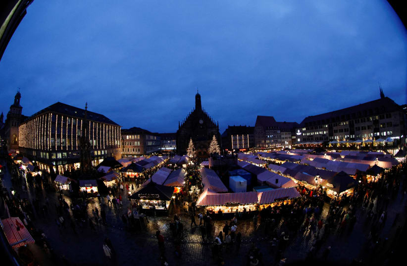   A file photo of "Nuernberger Christkindlesmarkt" (Christ Child Market), one of the world's oldest Christmas markets, opening in Nuremberg, Germany, November 25, 2022. The western German city of Duesseldorf closed Christmas markets in its historic city centre as a precaution on Dec 5, 2022, after p (photo credit: REUTERS/Heiko Becker/File Photo)