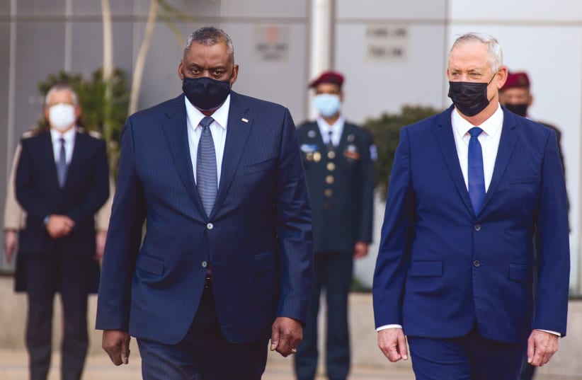  DEFENSE MINISTER Benny Gantz walks alongside US Defense Secretary Lloyd Austin during a ceremony at military headquarters in Tel Aviv, last year. (photo credit: TOMER NEUBERG/FLASH90)