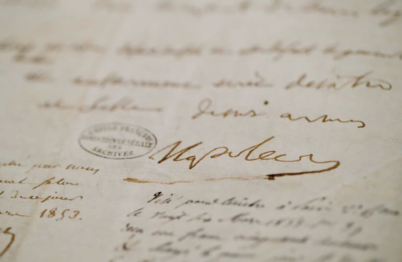  The signature reading ‘Napoleon’ is seen on Napoleon’s last will and testament, written in 1821, which is displayed in the Musee de l’Armee (Army Museum) at the Hotel des Invalides in Paris. (photo credit: Sarah Meyssonnier/Reuters)