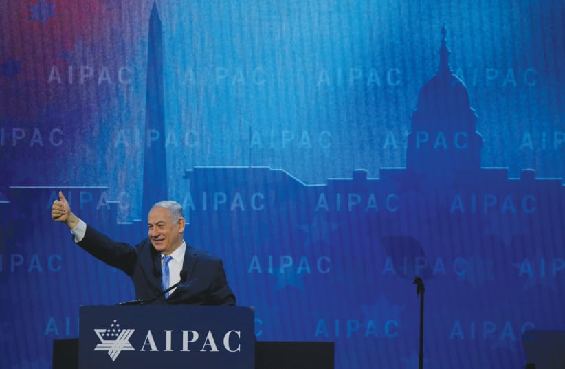  Then-Prime Minister Benjamin Netanyahu takes the stage to speak at the AIPAC Policy Conference in Washington, in 2018. (photo credit: REUTERS/BRIAN SNYDER)