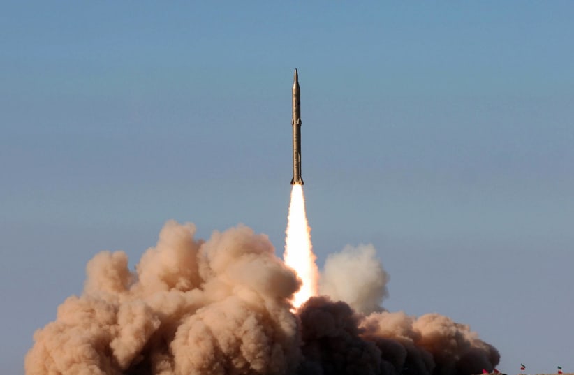  An Iranian missile takes off in 2008 during a test.  (photo credit: AFP VIA GETTY IMAGES)