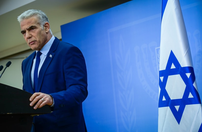  Yair Lapid holds a press conference in Tel Aviv on December 22, 2022.  (photo credit: TOMER NEUBERG/FLASH90)