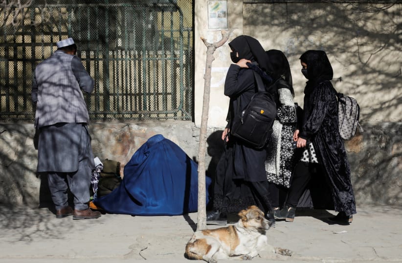 Afghan female students walk near Kabul University in Kabul, Afghanistan, December 21, 2022. (photo credit:  REUTERS/ALI KHARA)