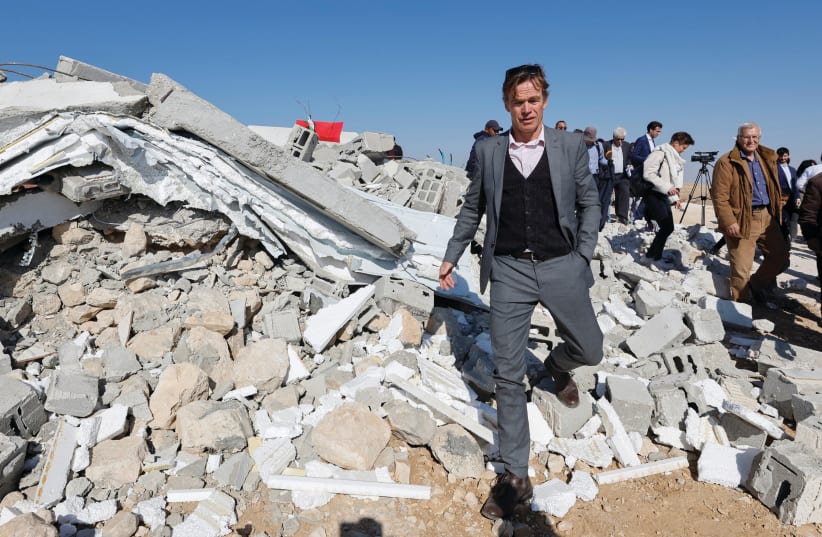  AMBASSADOR OF the European Union in Palestine Sven Kuhn von Burgsdorff walks near rubble during a visit to a school demolished by Israel, in Masafer Yatta near Hebron, last week (photo credit: MUSSA QAWASMA/REUTERS)