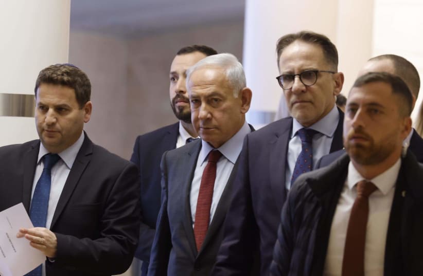  Israeli Prime Minister Benjamin Netanyahu is seen walking in the Knesset, in Jerusalem, on January 2, 2023. (photo credit: MARC ISRAEL SELLEM/THE JERUSALEM POST)