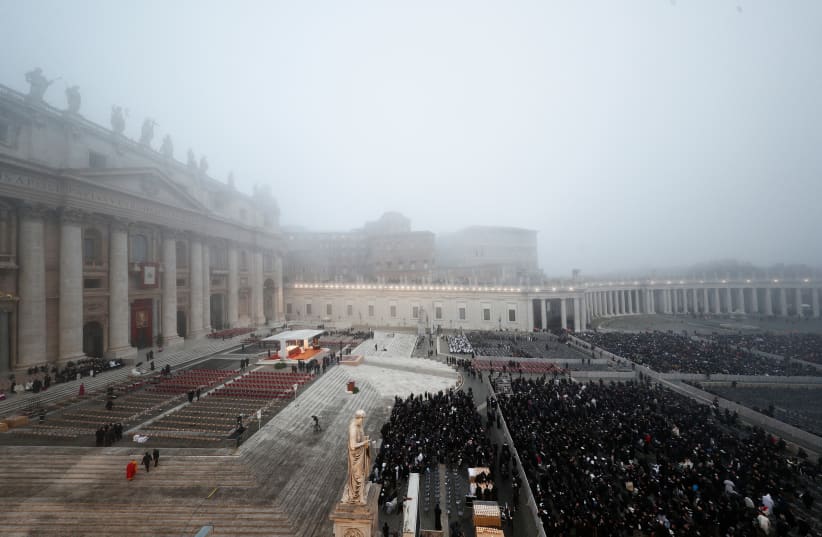  People gather at St. Peter's Square on the day of the funeral of former Pope Benedict at the Vatican, January 5, 2023. (photo credit: REUTERS/GUGLIELMO MANGIAPANE)