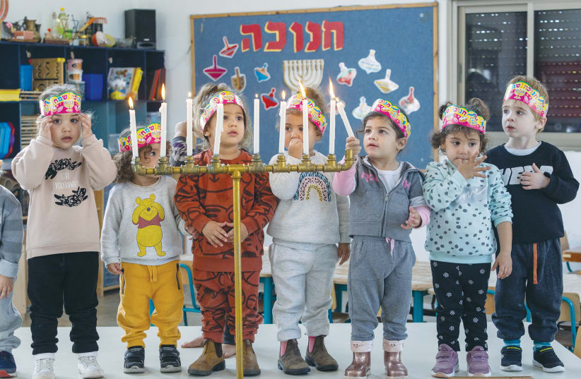  CHILDREN TAKE part in a Hanukkah candle lighting. (photo credit: YOSSI ALONI/FLASH90)