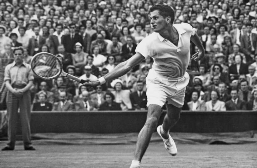  DICK SAVITT makes a backhand return to compatriot Herbie Flam during their semi-final match at Wimbledon on July 6, 1951. (photo credit: CENTRAL PRESS/HULTON ARCHIVE/GETTY IMAGES)