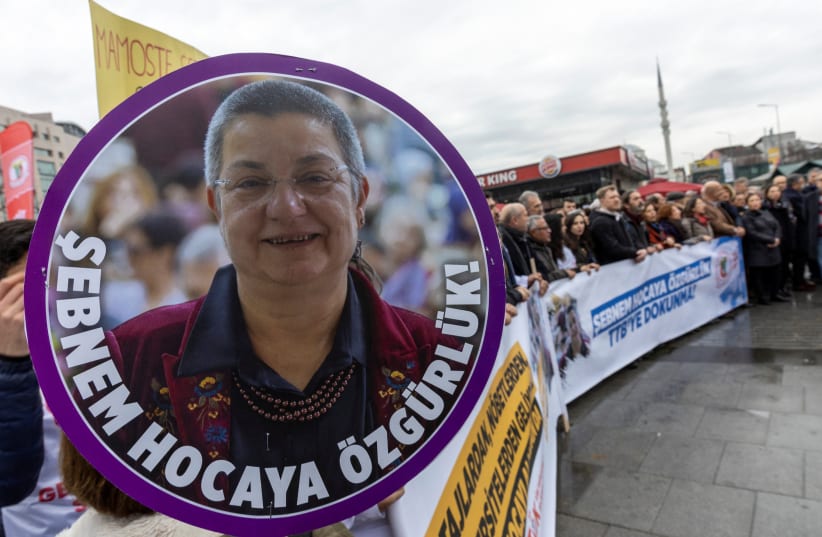 Supporters of the Turkish Medical Association (TTB) head Sebnem Korur Fincanc demonstrate in front of the Justice Palace, the Caglayan Courthouse, in Istanbul, Turkey January 11, 2023 (photo credit: REUTERS/UMIT BEKTAS)