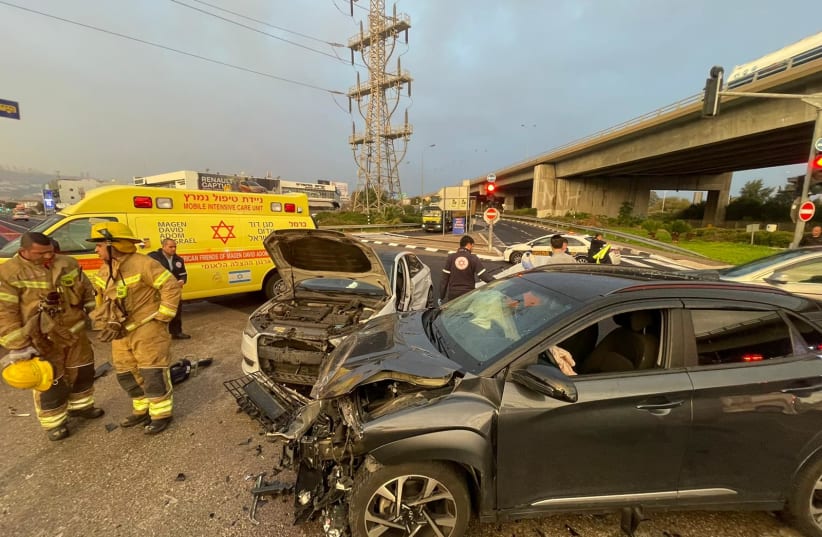  The sight of a car crash in Haifa, Israel, that injured two people, on January 13, 2023. (photo credit: FIRE AND RESCUE NORTHERN DIVISION)