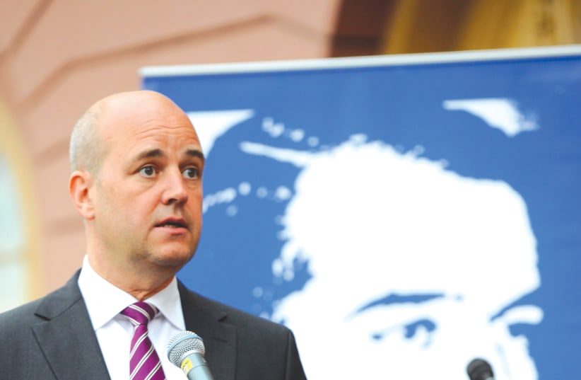  THEN-SWEDISH prime minister Fredrik Reinfeldt speaks during the inauguration of a memorial marking the centennial of Raoul Wallenberg’s birth, outside the Foreign Ministry in Stockholm, in 2012.  (photo credit: Scanpix Sweden/Reuters)
