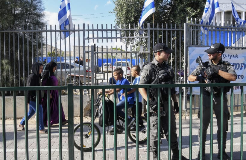  Israeli police officers secure a Jewish school following recent clashes between Jewish and Arab residents in the central Israeli city of Lod, May 23, 2021 (photo credit: FLASH90)
