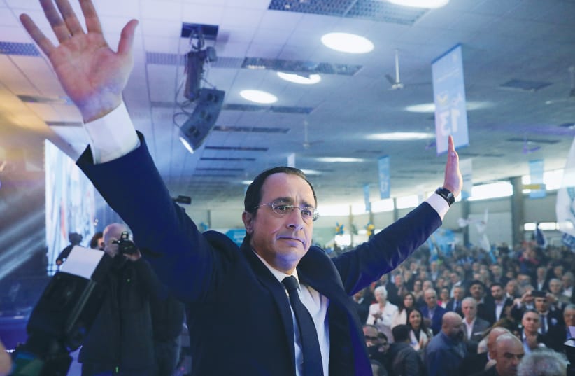  CYPRUS PRESIDENTIAL candidate Nikos Christodoulides waves to supporters during a pre-election rally in Nicosia, on Sunday. (photo credit: YIANNIS KOURTOGLOU/REUTERS)