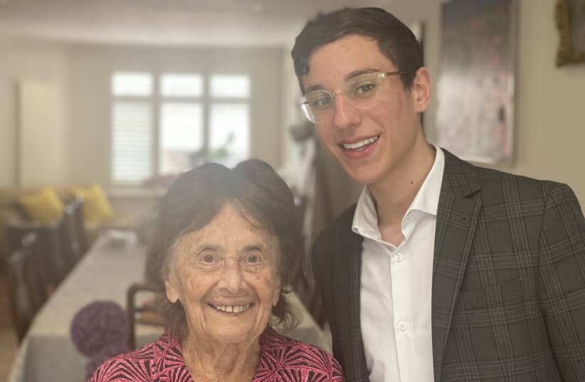  Lily Ebert (Left) standing next to her great-grandson Dov Forman (Right) (photo credit: Wikimedia Commons)