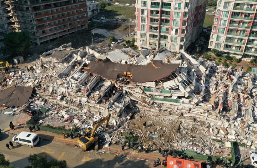  An aerial view shows collapsed and damaged buildings after an earthquake in Hatay, Turkey February 7, 2023. (photo credit: UMIT BEKTAS/REUTERS)