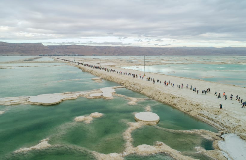  PARTICIPANTS IN THE Dead Sea Marathon on February 3 pass spectacular scenery  as they cross the rampart connecting Israel and Jordan. (photo credit: ELEMENTS)