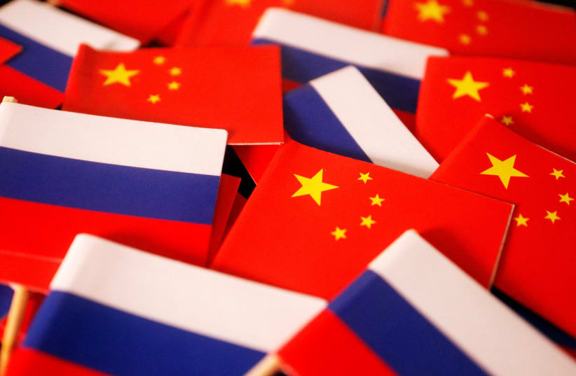 Flags of China and Russia are displayed in this illustration picture taken March 24, 2022. (photo credit: REUTERS/FLORENCE LO/ILLUSTRATION/FILE PHOTO)