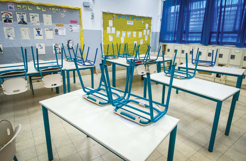  A CLASSROOM at a Tel Aviv school is empty due to a strike called by the Teachers’ Union. (photo credit: AVSHALOM SASSONI/FLASH90)