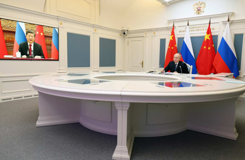  Russia's President Vladimir Putin holds talks with China's President Xi Jinping via a video link from Moscow, Russia, December 30, 2022 (photo credit: SPUTNIK/MIKHAIL KURAVLEV/KREMLIN VIA REUTERS)
