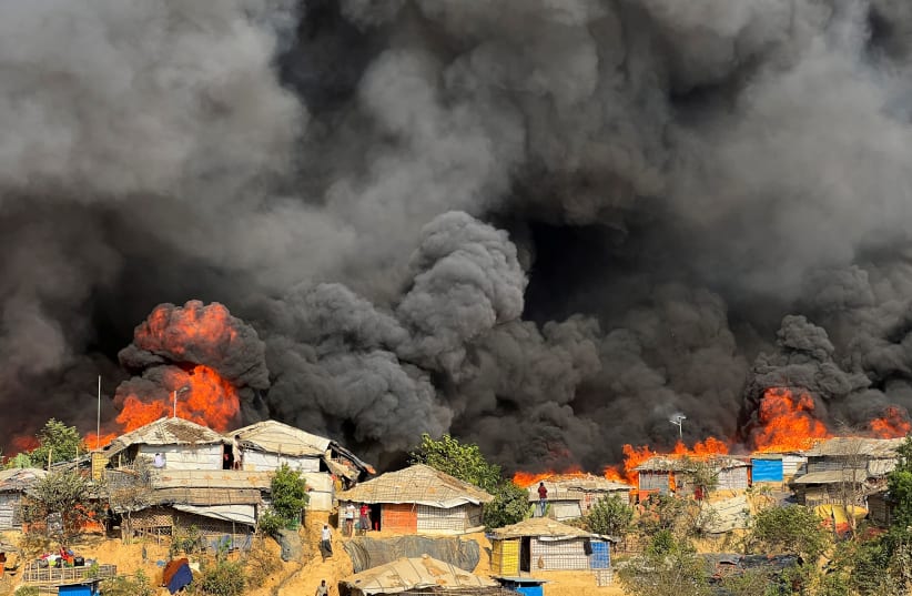  Fire burns in the Rohingya refugee camp in Balukhali in Cox's Bazar, Bangladesh, March 5, 2023.  (photo credit: REUTERS/RO YASSIN ABDUMONAB)