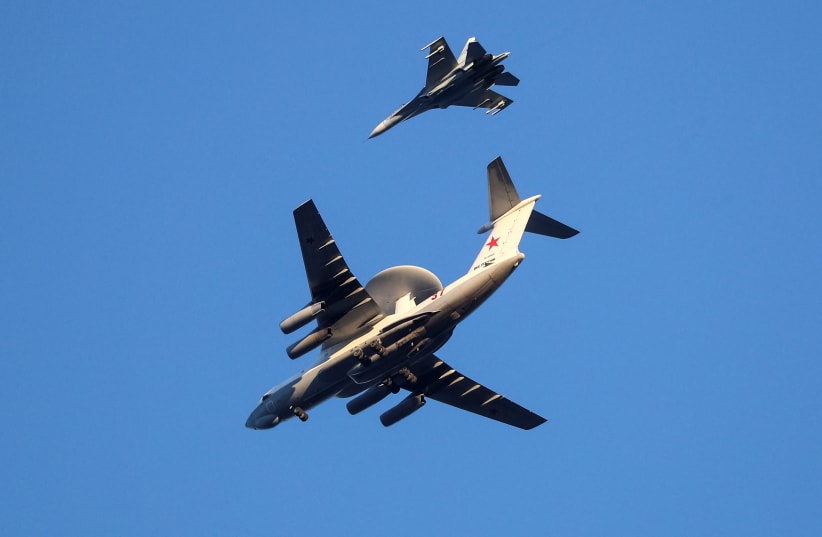  Russian Air Force Beriev A-50 early warning aircraft and Sukhoi Su-27 jet fighter fly in Kaliningrad, Russia April 25, 2020. Picture taken April 25, 2020. (photo credit: VITALY NEVAR/REUTERS)