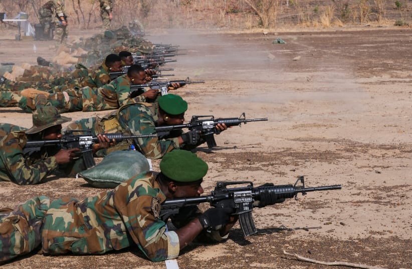 Ghanaian military personnel train shooting during the annual counter-terrorism program called "Operation Flintlock", in Daboya, Ghana March 2, 2023. (photo credit: REUTERS/FRANCIS KOKOROKO)