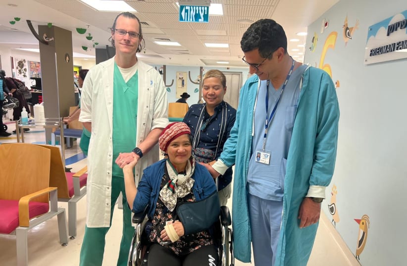  From left, Dr. Mausbach, Alma (Norila’s caretaker), Norila, Dr. David Hazon (photo credit: SHAARE ZEDEK MEDICAL CENTER)