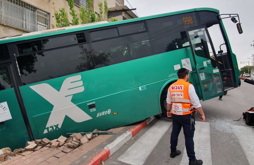 Bus slides off road near Haifa on March 22, 2023. (photo credit: HATZALAH UNITED)