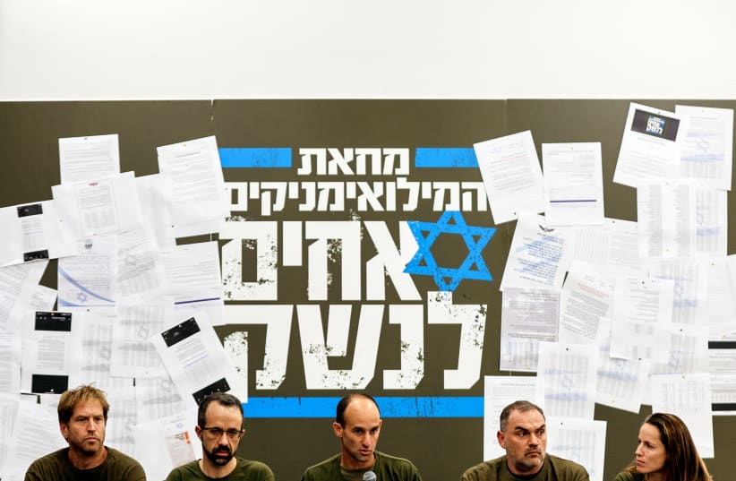  Members of Israel's 'Brothers in Arms' reservist protest group hold a news conference as Prime Minister Benjamin Netanyahu's coalition government presses on with its judicial overhaul, in Herzliya near Tel Aviv, Israel, March 21, 2023 (photo credit: REUTERS/AMIR COHEN)