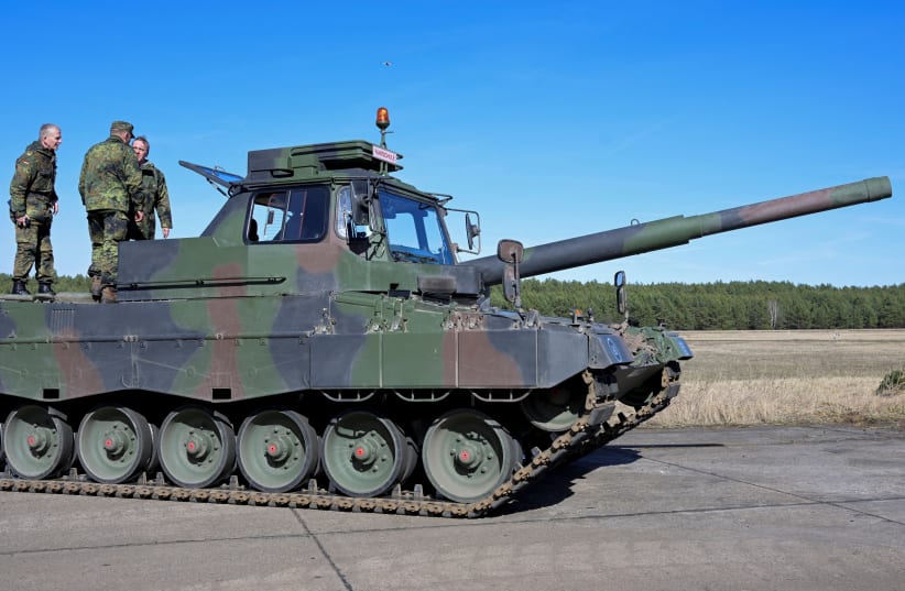  German Defence Minister Boris Pistorius stands on a Leopard training tank as he visits a training site of German army Bundeswehr in Mahlwinkel, near Magdeburg, in Germany March 16, 2023.  (photo credit: REUTERS/FABIAN BIMMER)