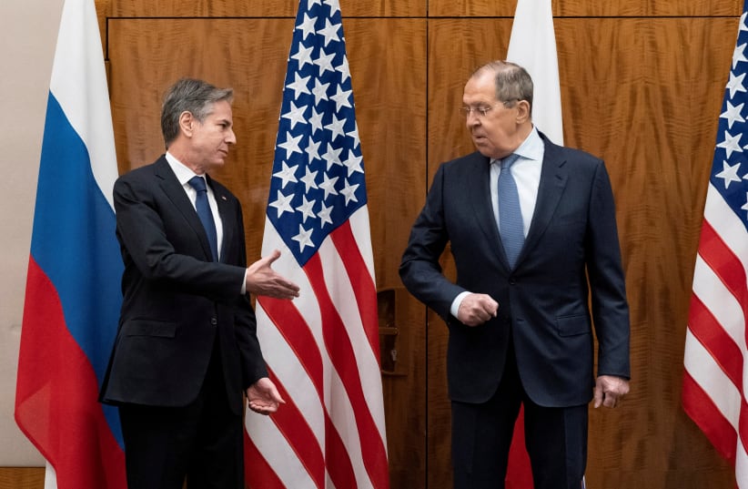 U.S. Secretary of State Antony Blinken greets Russian Foreign Minister Sergei Lavrov before their meeting, in Geneva, Switzerland, January 21, 2022 (photo credit: REUTERS)