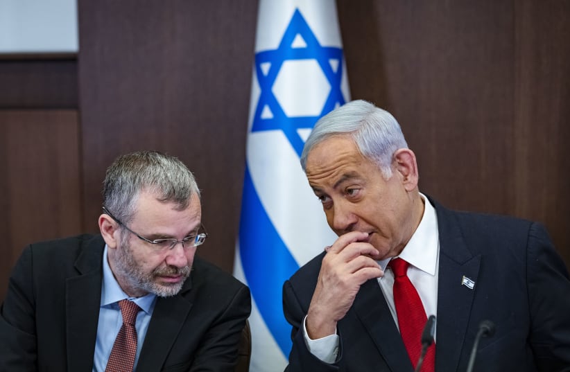 Prime Minister Benjamin Netanyahu and Justice Minister Yariv Levin are seen in a goveernment cabinet meeting in Jerusalem, April 2, 2023  (photo credit: OLIVIER FITOUSSI/POOL)