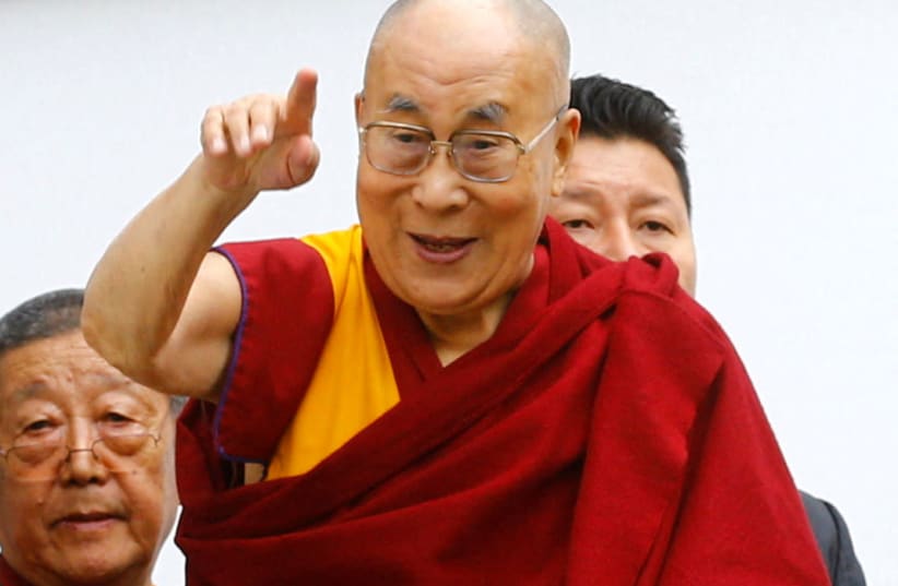  Tibetan spiritual leader the Dalai Lama gestures as he arrives for his visit to the Tibet Institute Rikon in Rikon, Switzerland September 21, 2018. (photo credit: Arnd Wiegmann/Reuters)