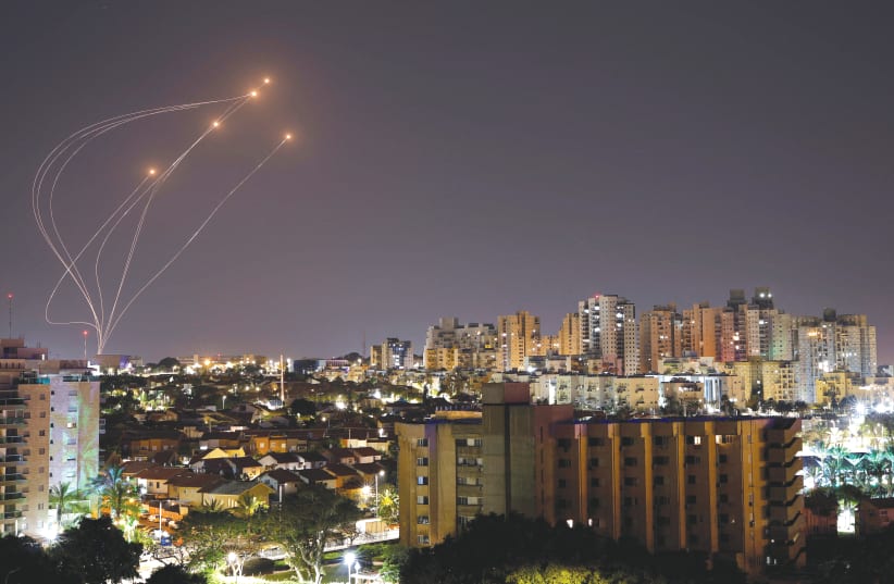  THE IRON DOME anti-missile system intercepts rockets launched from Gaza at the weekend, as seen from Ashkelon. (photo credit: AMIR COHEN/REUTERS)