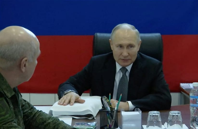  Russian President Vladimir Putin visits the headquarters of the "Dnieper" army group in the Kherson Region, Russian-controlled Ukraine, in this still image taken from handout video released on April 18, 2023. (photo credit: KREMLIN.RU/HANDOUT VIA REUTERS)