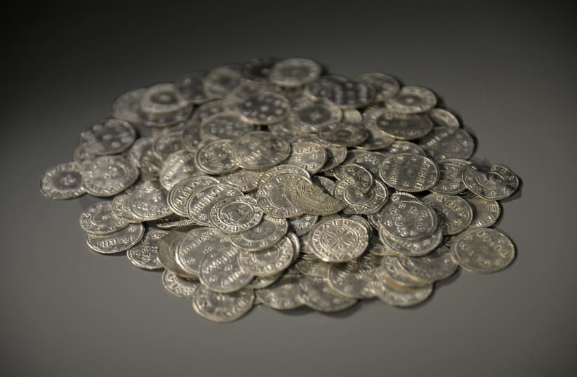 Anglo Saxon and Anglo Viking coins dating from the tenth century are displayed at the British Museum in London March 4, 2014. The coins are part of a major new exhibition 'Vikings: Life and Legend' which runs from March 6 to June 22 (photo credit: TOBY MELVILLE/REUTERS)