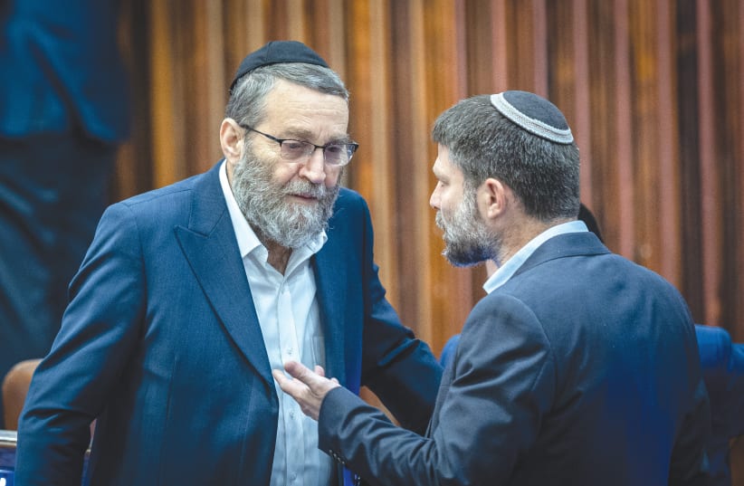  FINANCE MINISTER Bezalel Smotrich and United Torah Judaism MK Moshe Gafni confer in the Knesset plenum. (photo credit: YONATAN SINDEL/FLASH90)