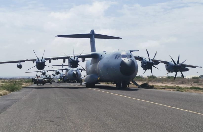  Spanish military plane and military vehicles are seen departing on tarmac as Spanish diplomatic personnel and citizens are evacuated, in Khartoum, Sudan, April 23, 2023. (photo credit: SPANISH DEFENCE MINISTRY HANDOUT/REUTERS)