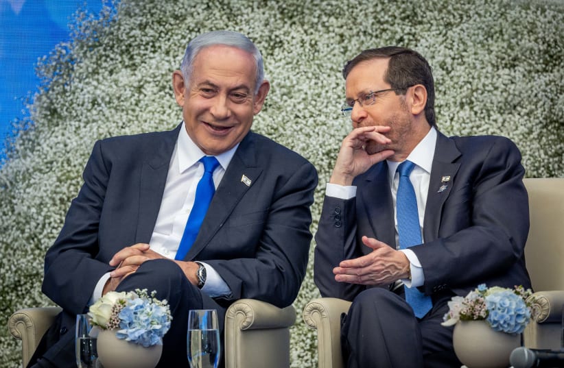  Israeli president Isaac Herzog and Israeli Prime Minister Benjamin Netanyahu at event for outstanding soldiers as part of Israel's 75th Independence Day celebrations, at the President's residence in Jerusalem on April 26, 2023. (photo credit: YONATAN SINDEL/FLASH90)