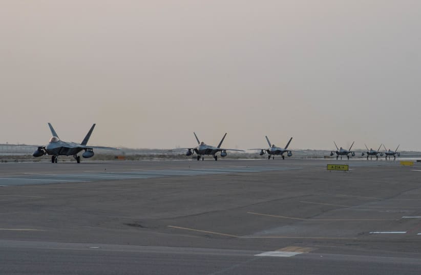  U.S. Air Force F-22 Raptors arrive at Al Dhafra Air Base, Abu Dhabi, United Arab Emirates, in this photo taken on February 12, 2022 and released by the U.S. Air Force on February 12, 2022. (photo credit: U.S. Air Force Central Command/Sgt. Chelsea E. FitzPatrick/Handout via REUTERS)