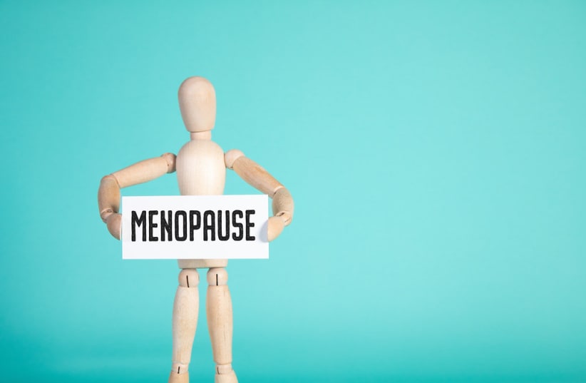  Wooden dummy holding menopause sign (photo credit: FLICKR)